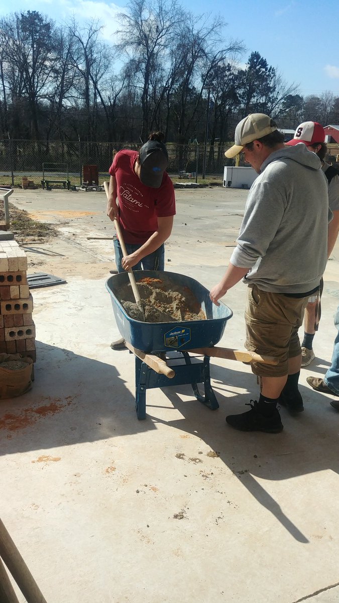 2019_srhs's tweet photo. Masonry 2&amp;3 getting some real world experience in the ditches. They have poured concrete, and now laying the block great job y'all. She even got her shoes muddy. #rss_cte #rssctemonth https://t.co/aiDVeaGBOl