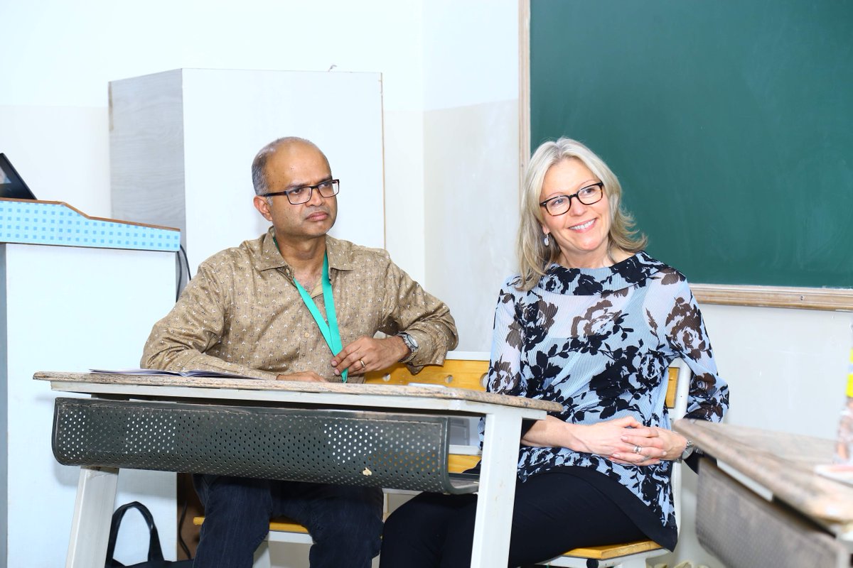 Betsy Beaumon and Sriram Rajamani seated at a desk.