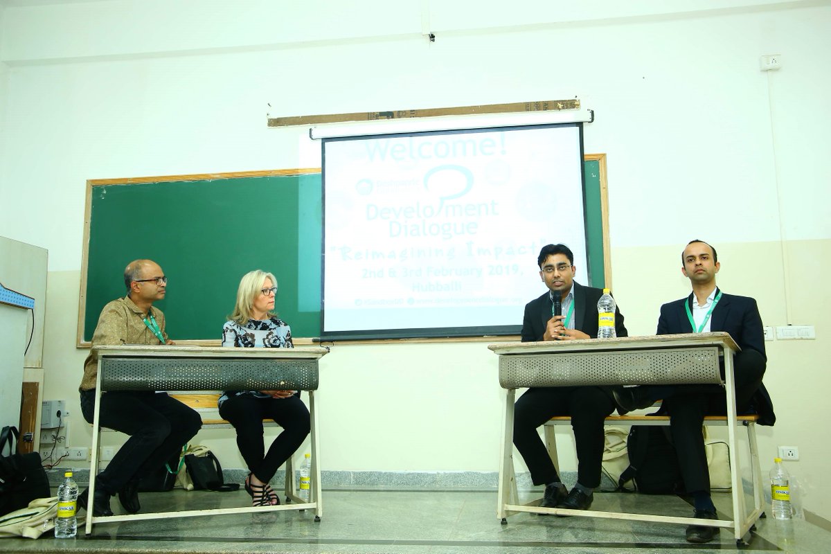 Betsy Beaumon, Shashank Pandey, Sukhpreet Sekhon, and Sriram Rajamani seated in front of a classroom.