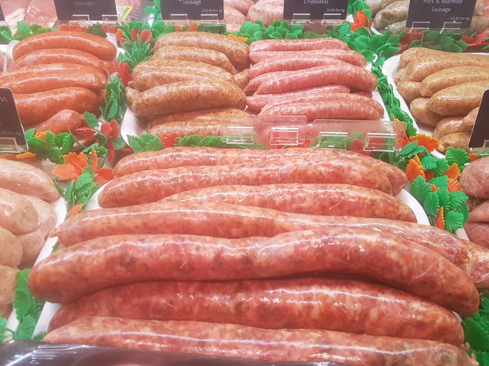 An average Friday morning display from our #butchers.  Always the lowest food miles with our fresh meat!! Today there are thirteen varieties of #sausage, including an Italian style jumbo sausage with tomato, chorizo, and mixed herbs. #sharnfoldfarm #farmshop #coffeeshop #local