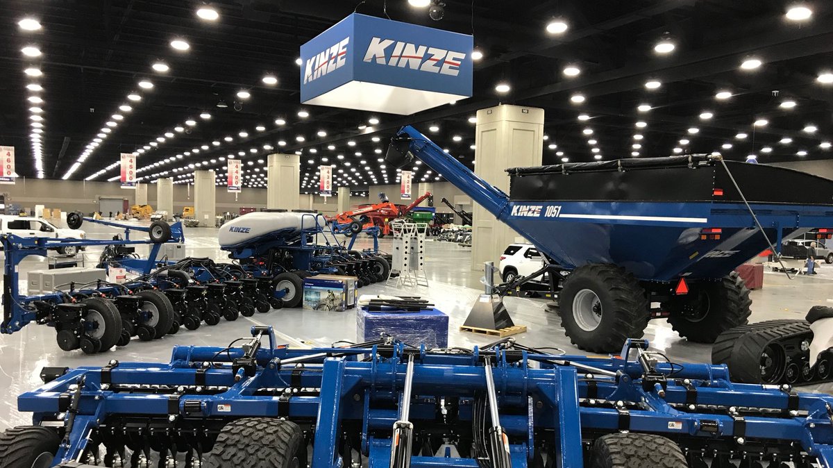 Kinze's tweet photo. Booth #4499 is being set-up for National Farm Machinery Show with some good looking blue equipment. Will we see you in Louisville next week? #Kinze #NFMS19 #BlueDrive #BlueVantage #MachTill #KinzeGrainCart https://t.co/QUWRakF0d8