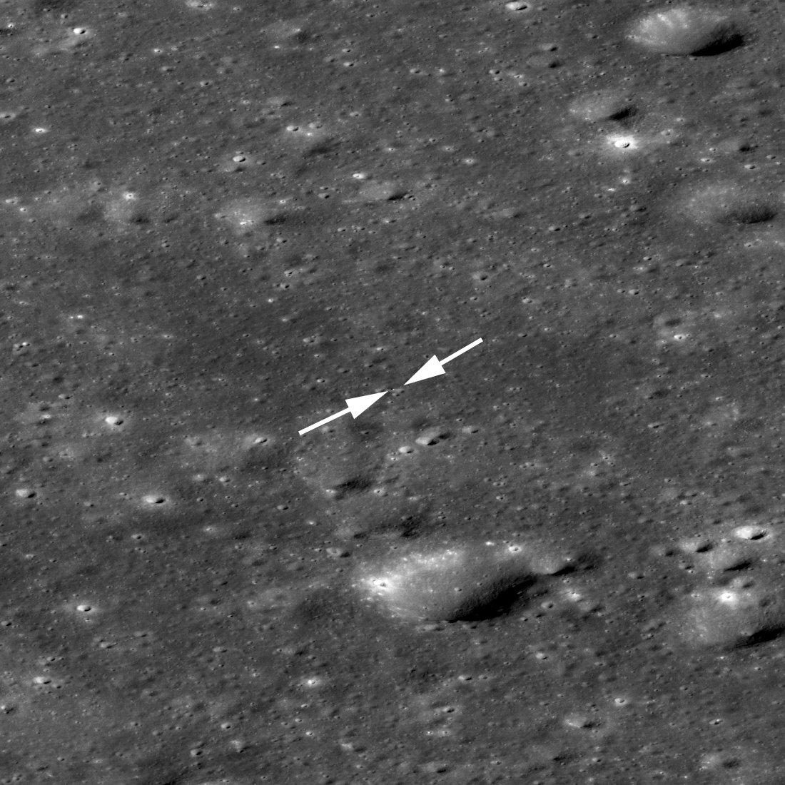 NASAMoon's tweet photo. A little bit closer now. @LRO_NASA captured this shot of the Chang’e lander and rover in Von Kármán Crater on January 30th. The left arrow points to the lander and the right arrow points to the even smaller rover, just 2 pixels across. https://t.co/Oxu60ucWxs https://t.co/ioILWBiD6r