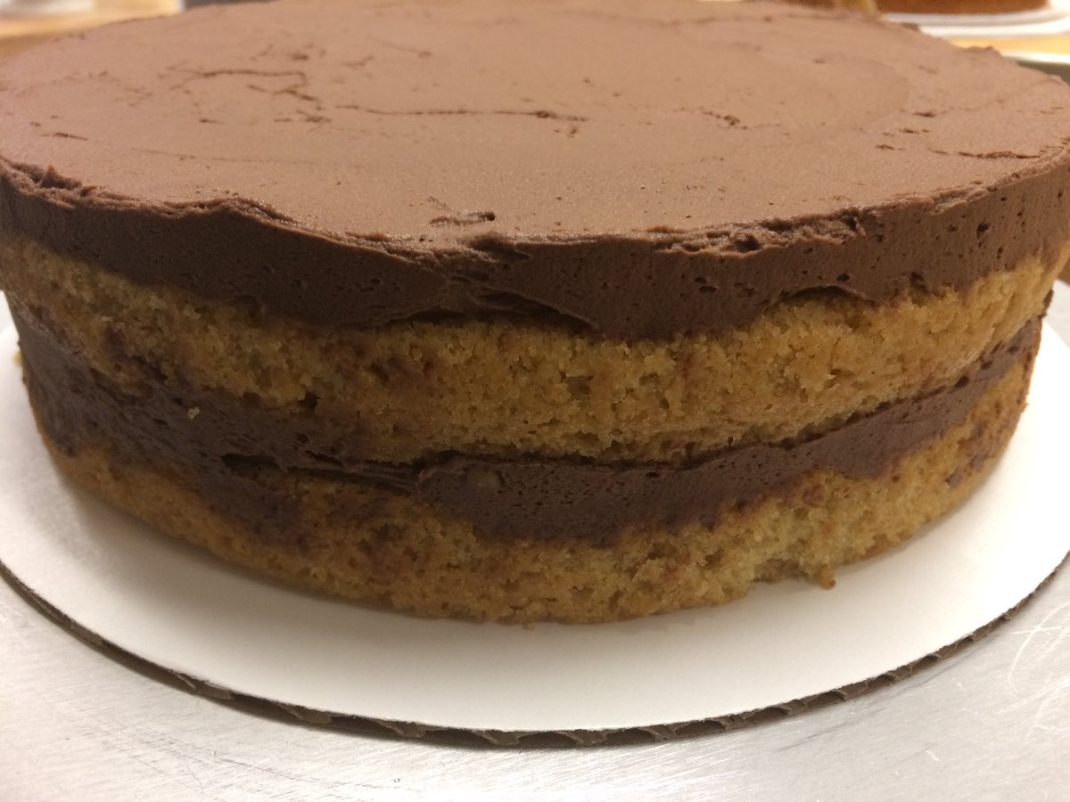 This s’mores cake is bound to make you want some more! Graham Cracker cake, whipped chocolate ganache, toasted Swiss meringue, and poured chocolate ganache! #ctcbakinglove #ctchullskitchen  #smores #cakedecorating