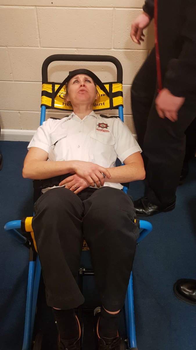 Evac chair training with our willing volunteer putting her faith and trust in the crew