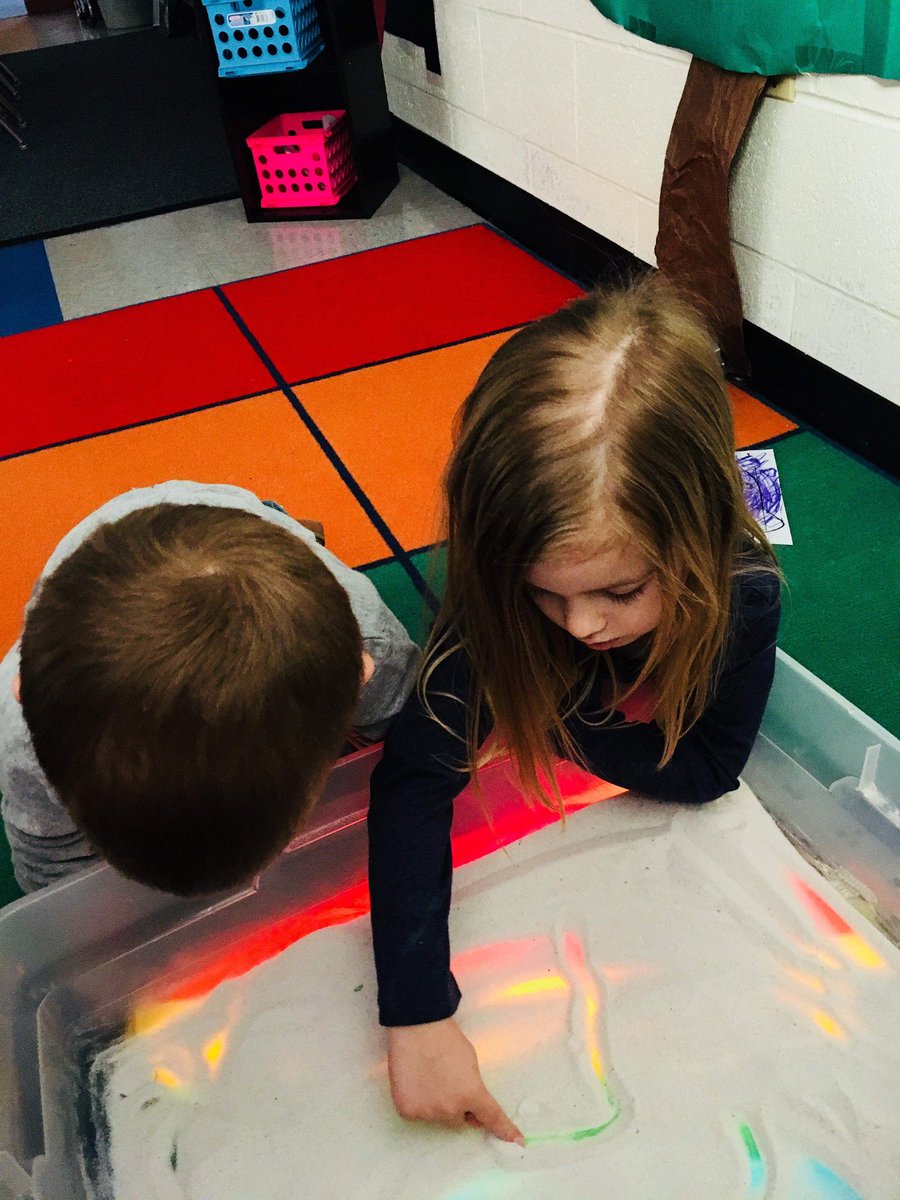 lesaschulte's tweet photo. We used Christmas lights, a tub, and tissue paper to make a light table! This week we added sand on top to practice our letters, numbers, and shapes! :) @USD303 https://t.co/Ext79wf74z