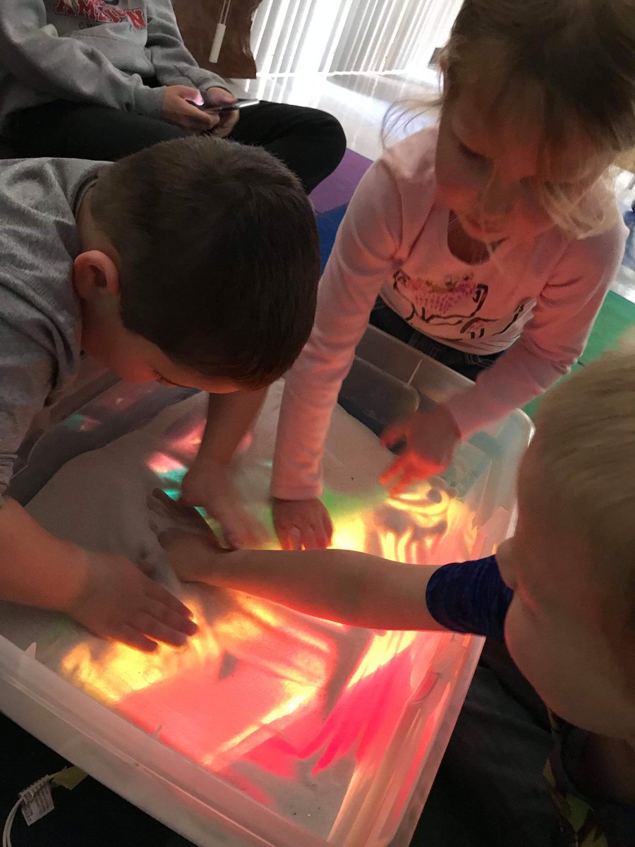 lesaschulte's tweet photo. We used Christmas lights, a tub, and tissue paper to make a light table! This week we added sand on top to practice our letters, numbers, and shapes! :) @USD303 https://t.co/Ext79wf74z