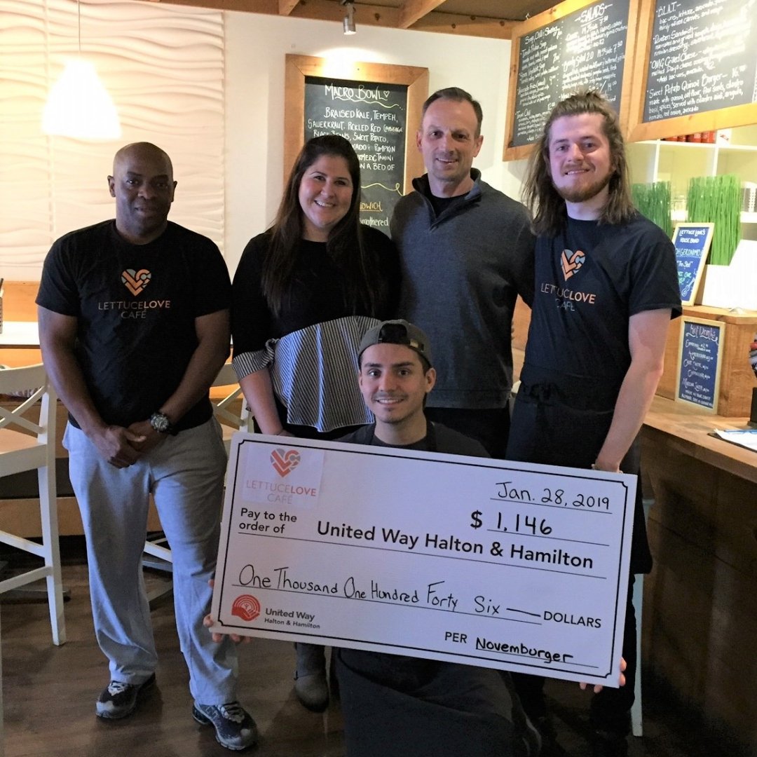 Check it out! Some of our crew and a member of The United Way holding up our donation from the Novemburger fundraiser. Thanks to all of our customers who participated & ordered our feature burger - The Big Veg (which is still available since it was so popular!)