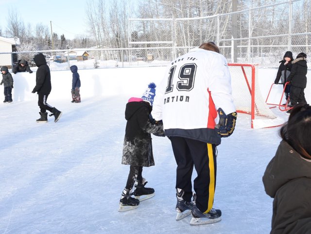 RCMPAlberta's tweet photo. D/Commr. Zablocki, Sgt. Hughes, #Chateh youth, and Dene Tha' council members skate to kick off the first of many seasons at the new Heek'iicho Mieh (Bison Pond) rink! #HockeyDayInChateh https://t.co/4Xv59sSPUs