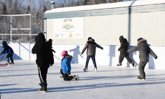 RCMPAlberta's tweet photo. D/Commr. Zablocki, Sgt. Hughes, #Chateh youth, and Dene Tha' council members skate to kick off the first of many seasons at the new Heek'iicho Mieh (Bison Pond) rink! #HockeyDayInChateh https://t.co/4Xv59sSPUs
