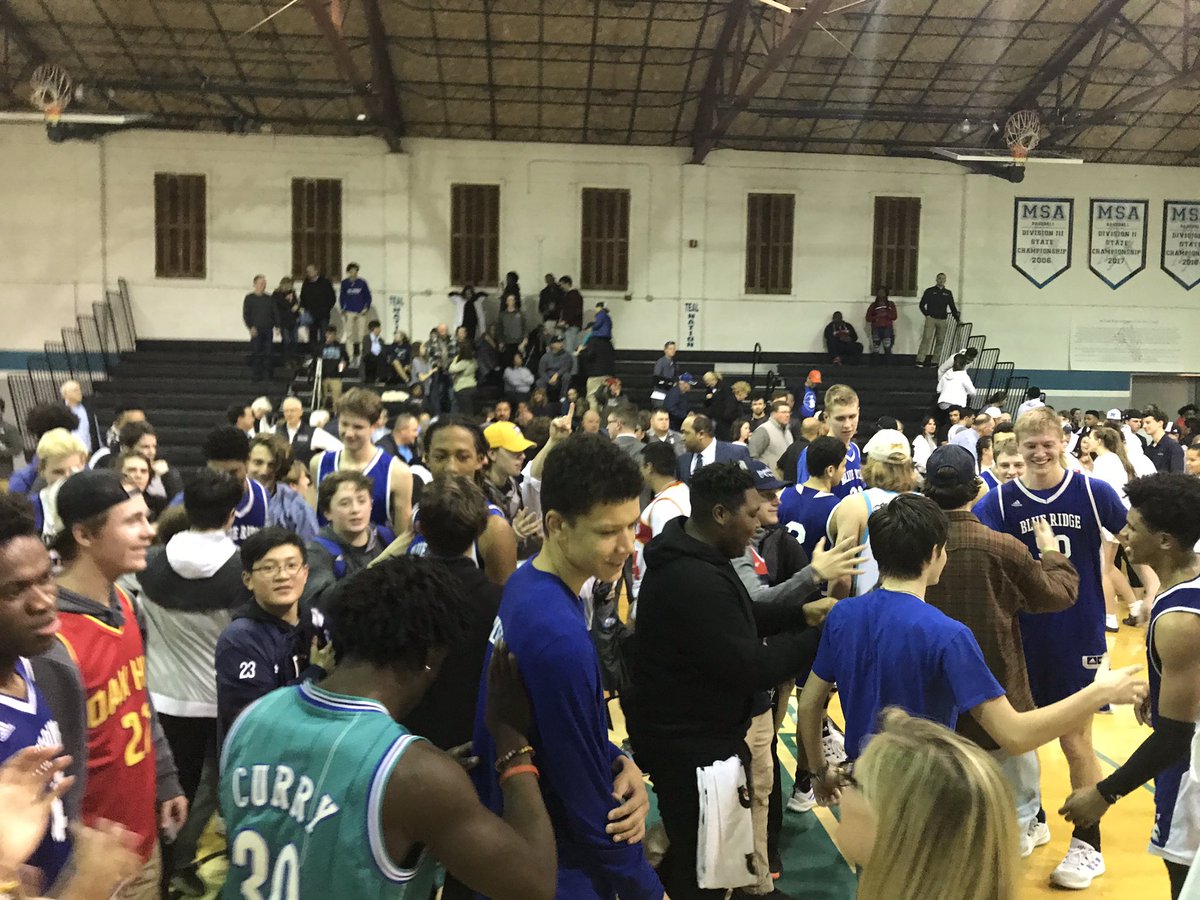 Blue Ridge boys basketball celebrates a big win over Miller on the road.
