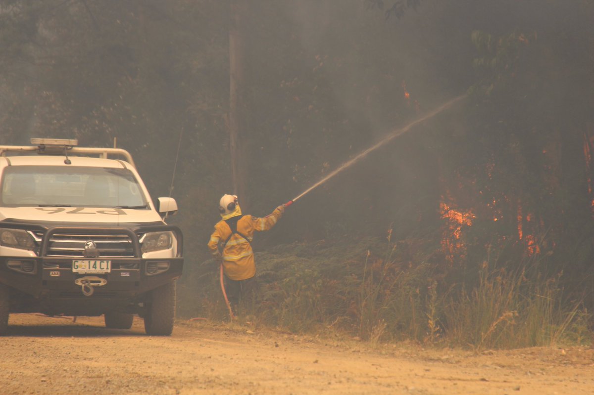 rhianawhitson's tweet photo. We’re with @TasFireService just off Arve Road about 15km from the Tahune Airwalk - which has sadly been destroyed by fire. Fire crews are trying to stop the blaze jumping this road and heading down to Costains Rd Geeveston. #tasfires @abchobart https://t.co/J2igBt6JqB