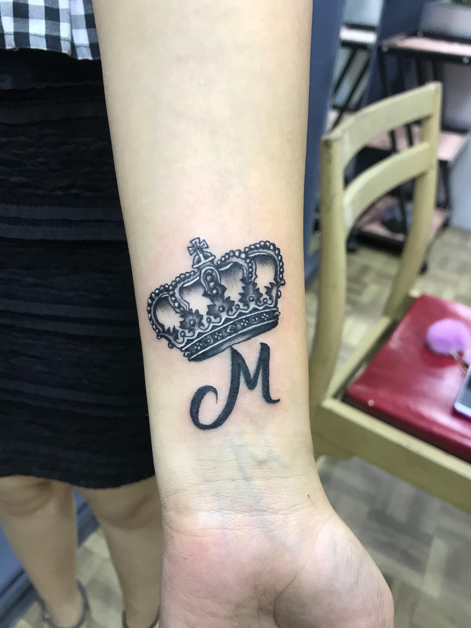 Back of the neck tattoo of a crown by Seoeon