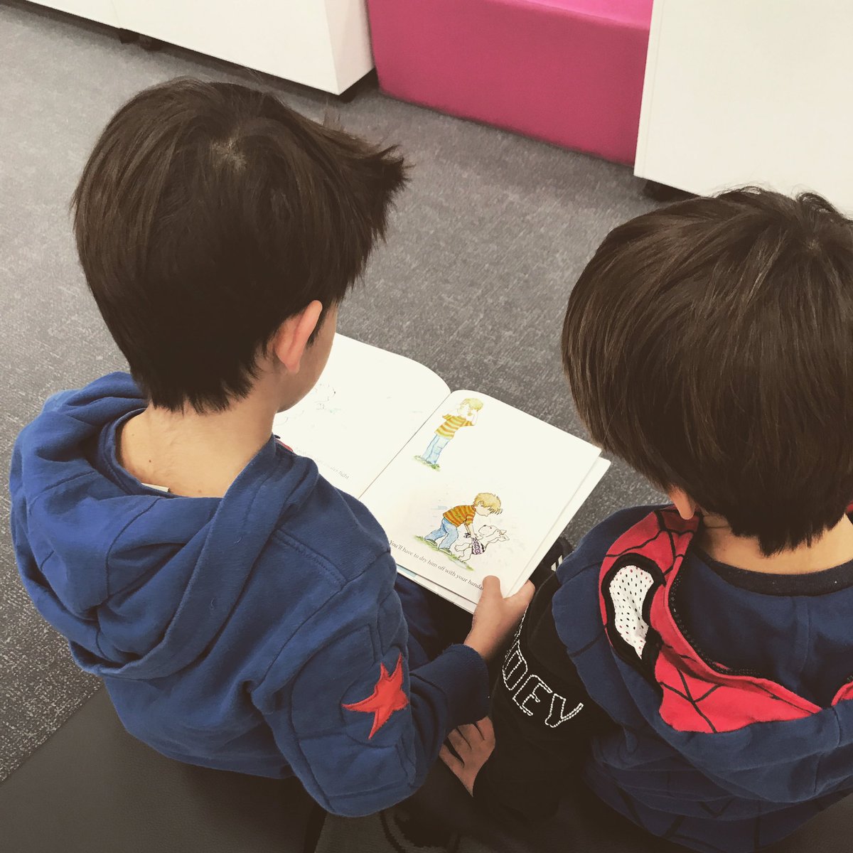 ASMLibrary's tweet photo. What a sweet scene to stumble upon first thing this morning. #brotherlylove #earlymorningreading #librarylife #librarylove #ASMreadseverywhere #ASMrocks @mikeamodio https://t.co/lhQuVGFcRg