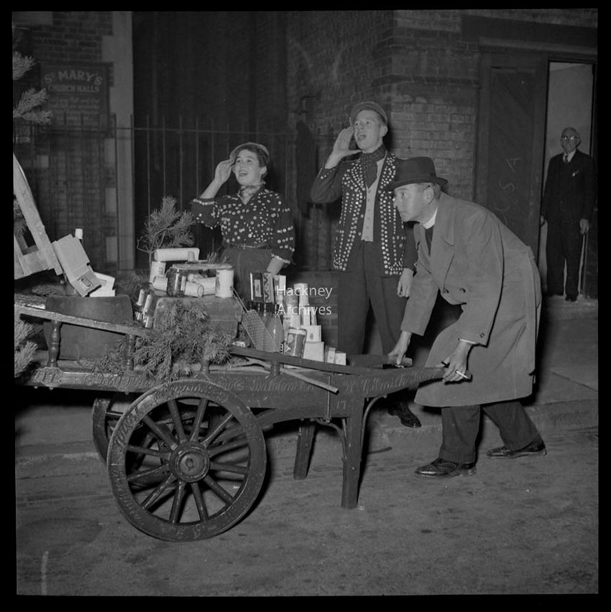 St Mary's Church in #StokeNewington advertising its Xmas Fair in 1955. We ❤️ the cheeky sign "Not a word to Rab" a reference to the then Chancellor of the Exchequer Rab Butler. Not sure about shorts in December tho! #taxfreeshopping #RAGibsonStudio