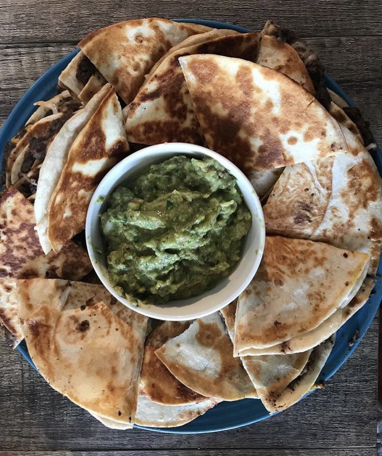 Vegan and medicated Crunchwrap; refried beans and cheese quesadillas with guac; seitan steak burrito