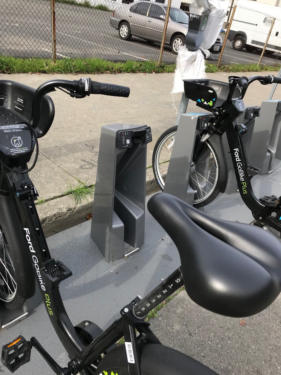 sonofabike's tweet photo. @ThePinakes @FordGoBike Sure enough, they're already being ripped off in broad daylight. Pictured: bikes at Jack London Sq station in Oakland, last weekend. https://t.co/ta7wNTinWI