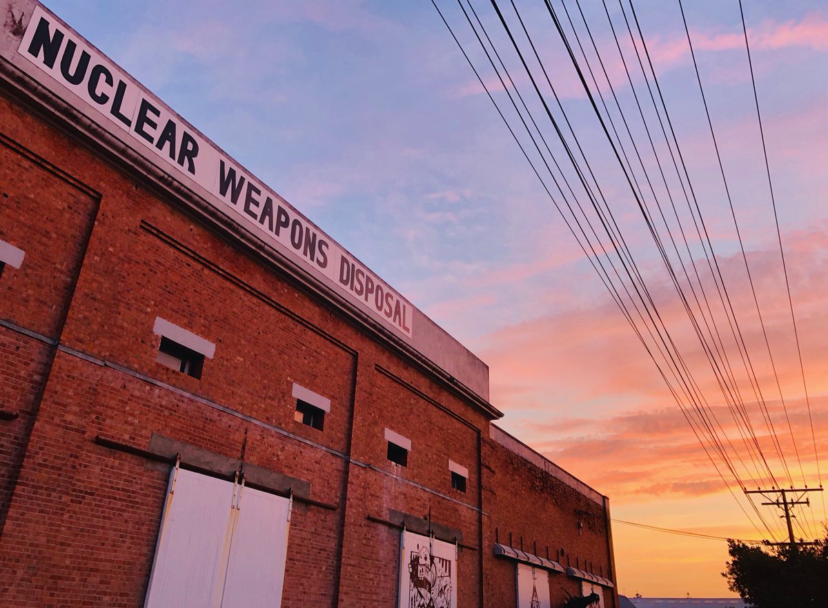 telling_stories's tweet photo. In the vain of the ‘elephant in the room’, or ‘in Gonville’. What’s the story of Whanganui’s Nuclear Weapons Disposal banner above the old wool sheds? Apart from maybe convincing Google Bots that there’s a connection between the town and a liberal nuclear policy during searches? https://t.co/Vnm3I9YT4z
