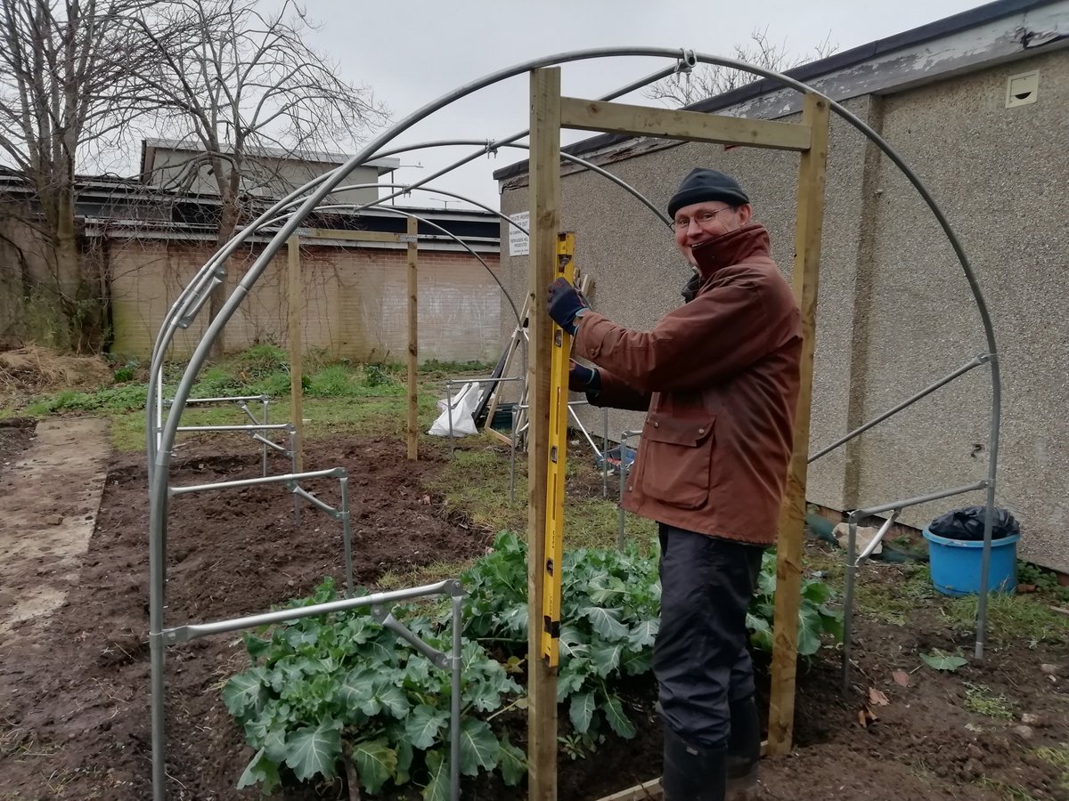 The poly tunnel has arrived! Director Chris is spending his last day in the office getting it all set up.