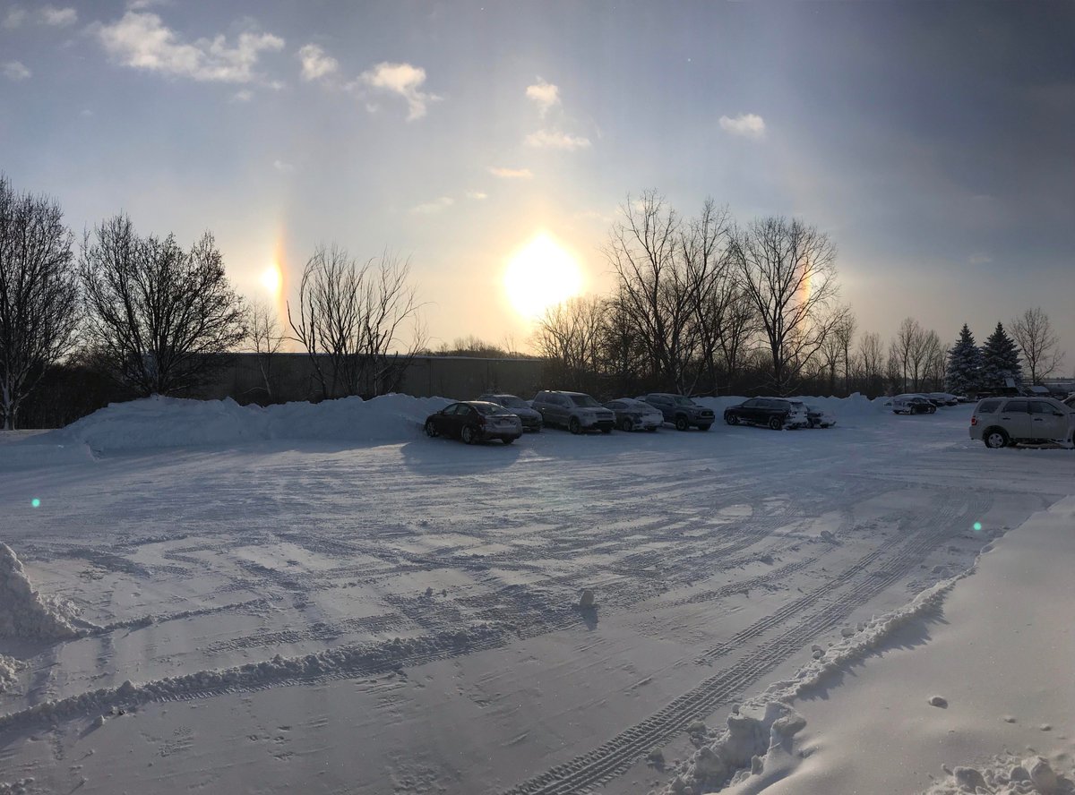 mackinacusa's tweet photo. Spectacular sundogs across the Mackinac parking lot this morn. Says Wikipedia: "Sun dogs are caused by the refraction and scattering of light from plate-shaped hexagonal ice crystals ... which act as prisms, bending the light rays passing through them." https://t.co/IhOnf8KY1H