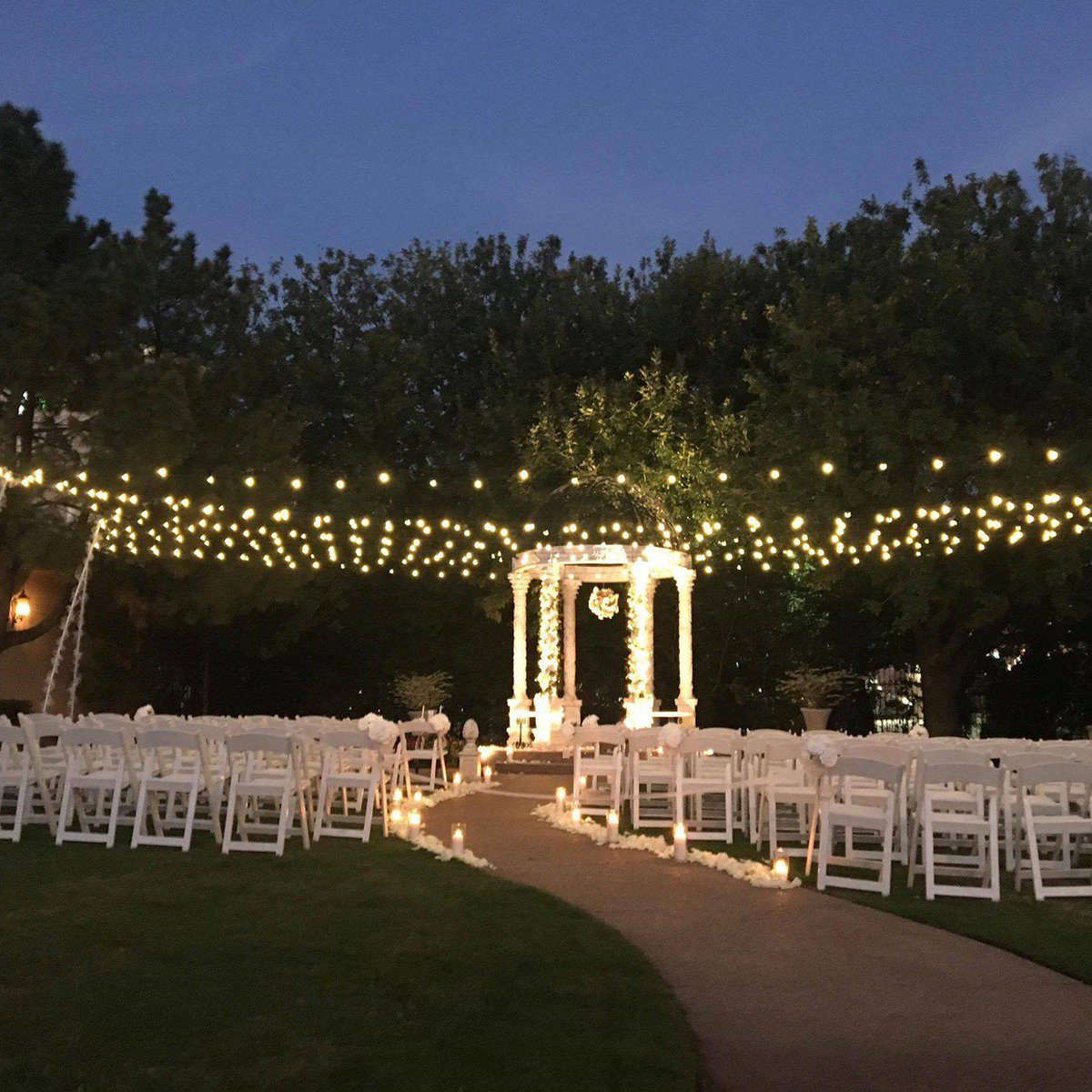 Sparkling lights and white florals add the perfect touch of romance to this wedding scene. Book your garden wedding with us today!

#gardenwedding #romance #weddingplanning #mymvwedding #mediterraneanvilla #dfwweddings #weddingvenue #outdoorwedding #fairytalewedding