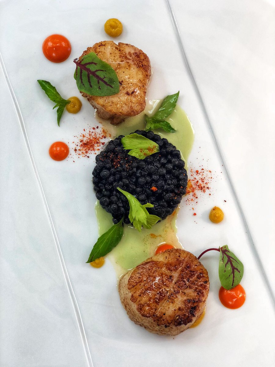 Our four-course Pre-Theatre menu includes this dish of Day Boat Scallops, garnished with cous cous, ginger, kaffir lime, and Thai basil. We'll see you before curtain time—book your table through the link above.