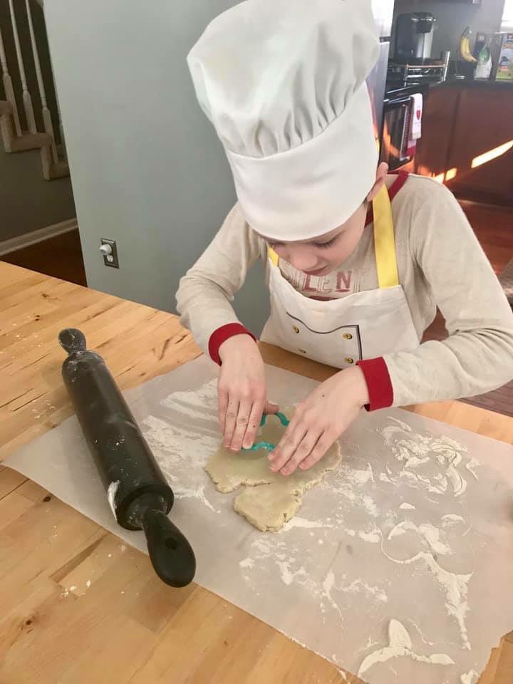 SLCSpearson's tweet photo. These #pearsonpioneers accepted the #colddaycooking challenge and made some Valentine cookies I love the apron and chef hat ❤️!#polarvortex19 https://t.co/THu6vcDKSz