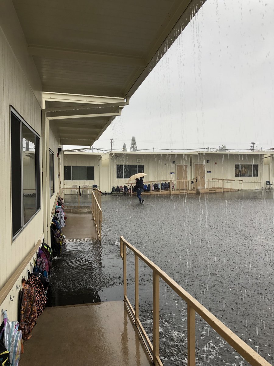 Buncahn's tweet photo. my sister is a middle school special ed teacher. this is a photo of her carrying one of her students to the bathroom on her back in the rain. she also buys supplies with her own money. i wrote a poop joke on twitter yesterday https://t.co/iuEGT7Zo5e