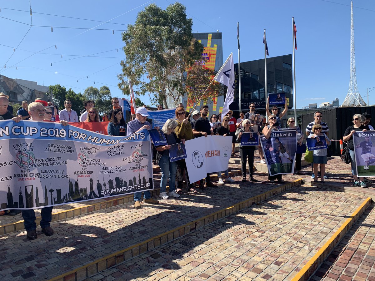 DougalBeatty's tweet photo. Protesters gather at Fed Square calling for detained refugee soccer player Hakeem Al-Araibi to the brought back to Melbourne from Thailand #SaveHakeem @9NewsMelb https://t.co/2rb3TbqVUf