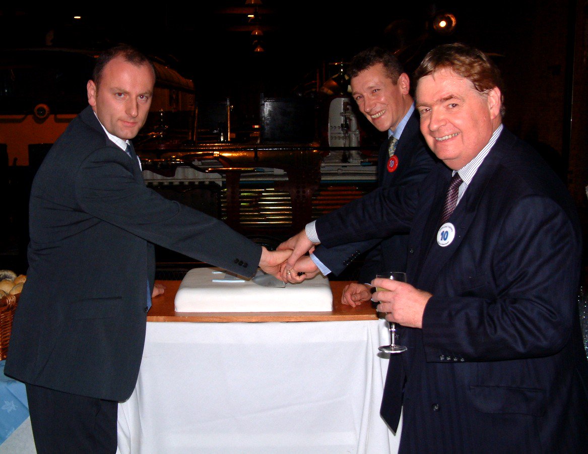 WattsManchester's tweet photo. Celebrating our 26th Birthday in Manchester today.  Looking back 16 years to the office's 10th Birthday with Ian Ford our office founder, Norman Potter and Paul Fernley who were there at the start https://t.co/JUME2IFAsv