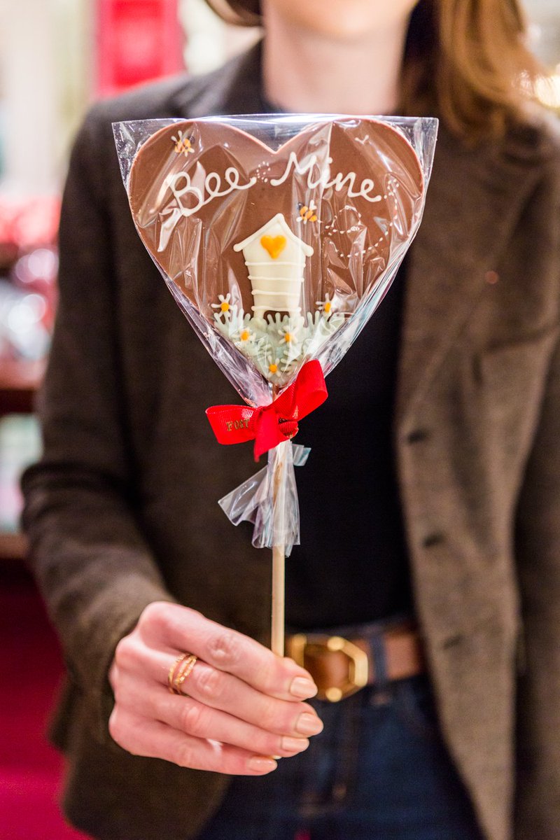 Fortnums's tweet photo. Our honey-sweet Bee-Mine Lolly is the sweetest way to declare your love this Valentine's Day. Handmade in England with the finest Belgian milk chocolate > https://t.co/dykYYrPzbP https://t.co/z85LVBoasK