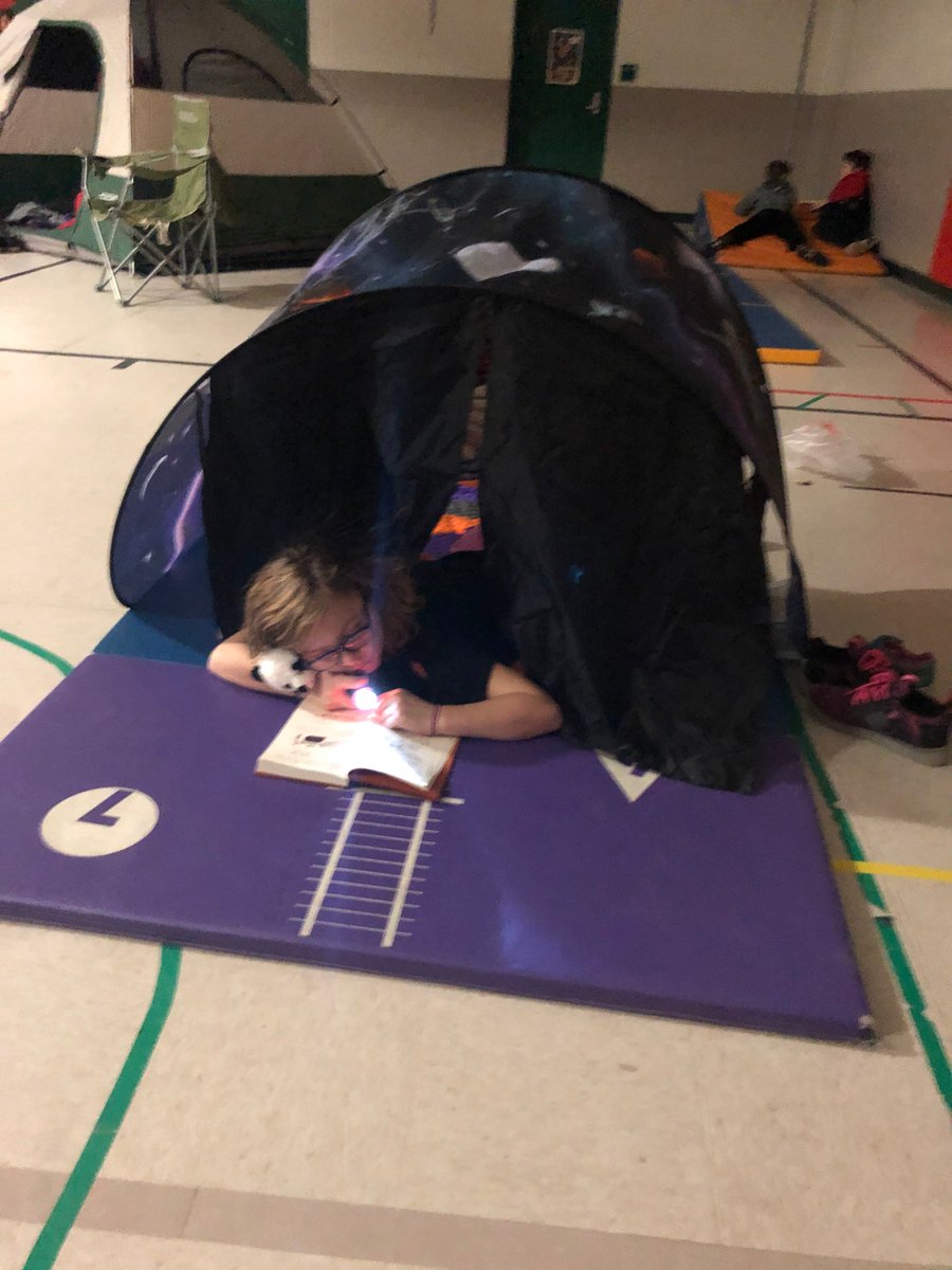 PullmanElem's tweet photo. After being out of school for four days, we are celebrating I Love to Read Month with Flashlight Reading in the gym today!  We are feeling pretty cozy with our books! #ilovetoreadmonth https://t.co/zdis5kYnt7