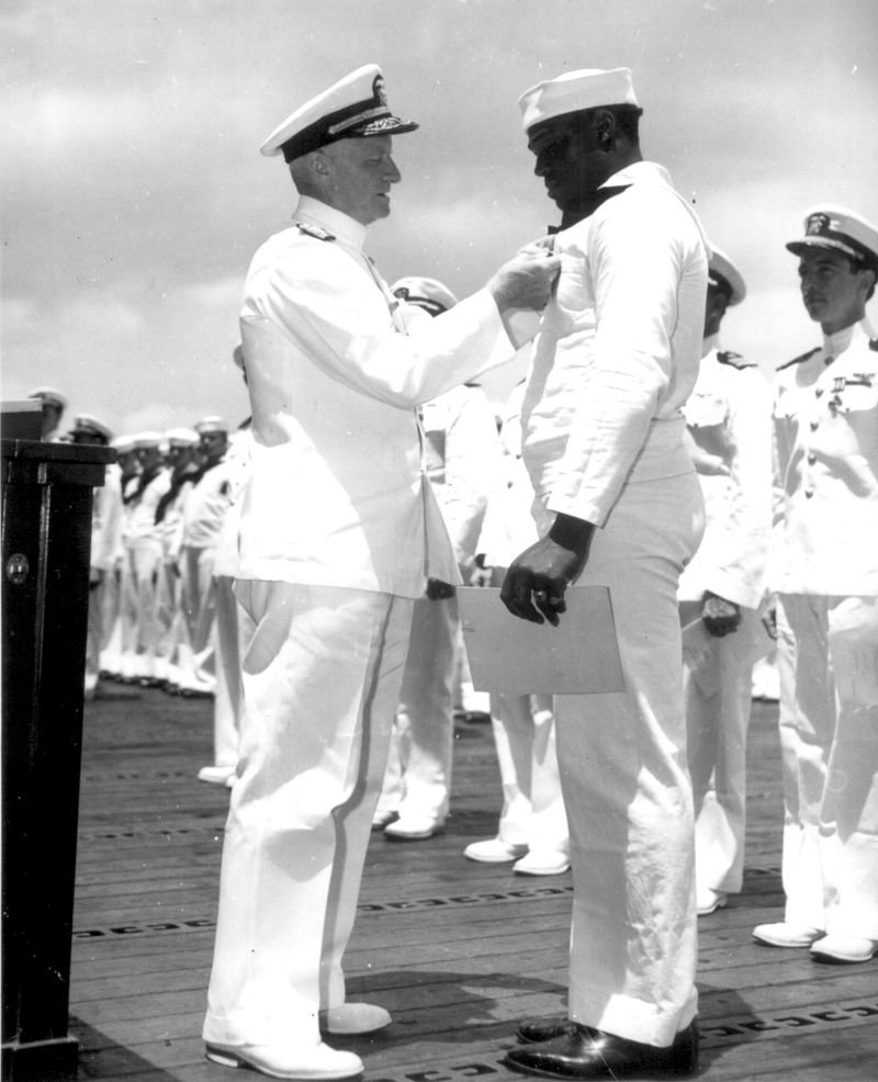 Here's a picture of Miller receiving the Navy Cross from Admiral Chester W. Nimitz (an honor that came about partly because Afr-Am papers like the Pittsburgh Courier publicized his heroism). Tragically, Miller would die less than two years later, in the Battle of Makin Island.