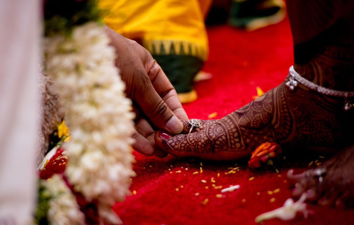 Did you know that the toe ring worn by the bride on her wedding day signifies the groom’s promise to protect her for life?
Photo courtesy: @PhotosMadeEz  
#wedding #weddingtraditions #weddingrituals #weddingjewellery #toerings #indianwedding #traditionalwedding  #weddingmoments