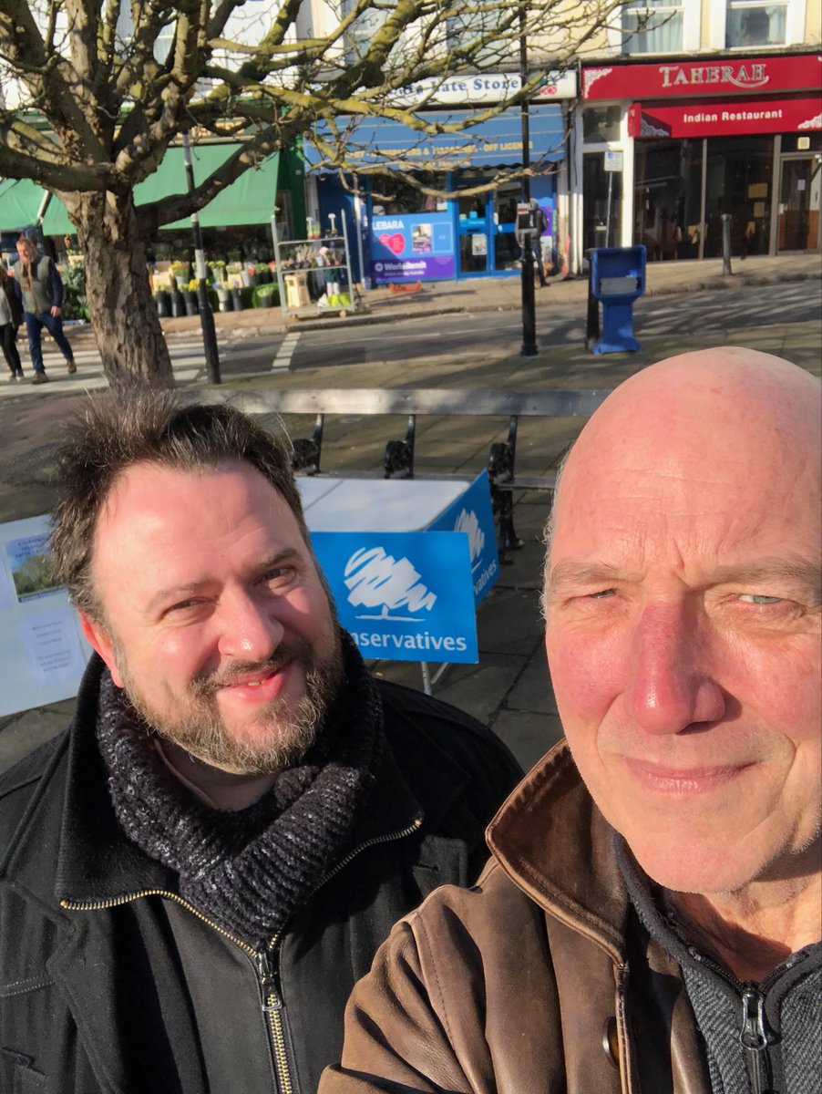 Steve and Gio happily in the sun at our street surgery in Belsize Village. Everyone is smiling this morning and no snow!