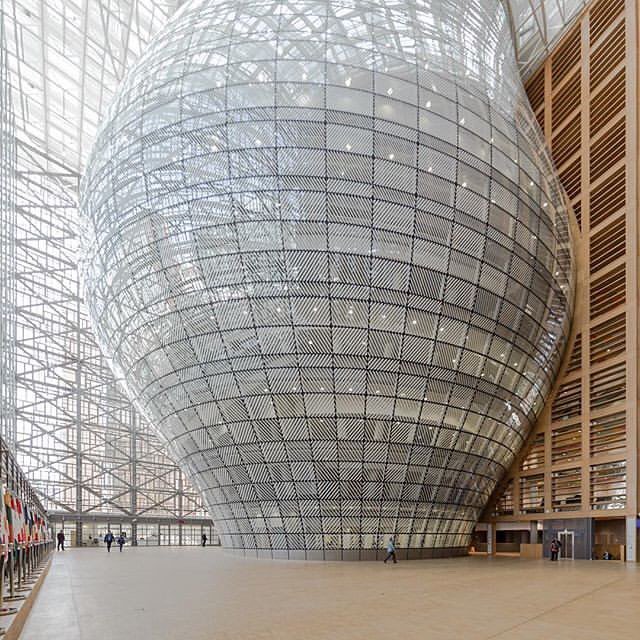 Glassatecture's tweet photo. The inside of the @samynandpartners designed Europa building in Brussels has a lantern like structure clad in trapezoidal glass panels that are diagonally banded, the white bands alternate direction from panel to panel and also vary in width to achieve different transparenci… https://t.co/TQMOaoIuuF
