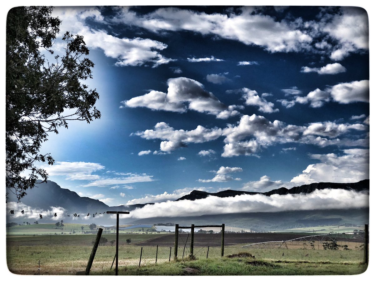 OZone_africa's tweet photo. #FlashRain just hit George and now the sun back out over the #outeniquamountains highlighting the #crossing riders will take on tomorrow on the @TranscapeMTB #route 💪🚴♂️⛰ https://t.co/6vlxt3m4Tz