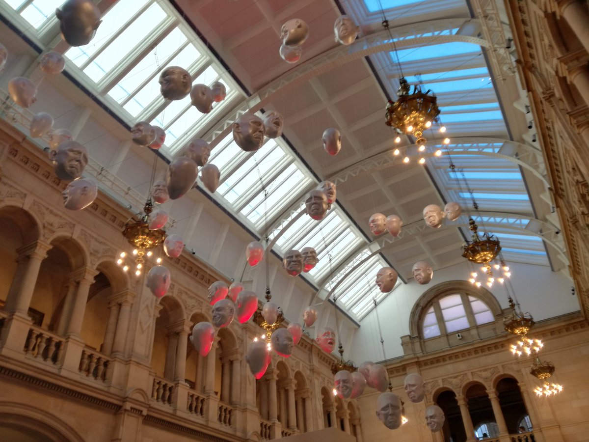 floating giant head sculptures in Kelvingrove museum