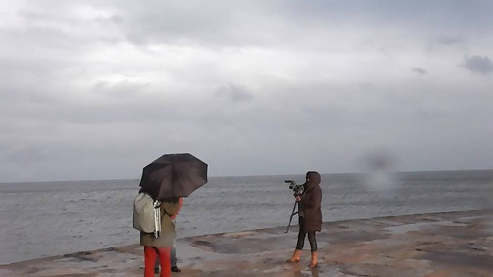 FableIsabella's tweet photo. Early days of the shooting , the crew and director Sarah MacGregor at the famous #WhitbyLighthouse https://t.co/QcLj9QAhhr