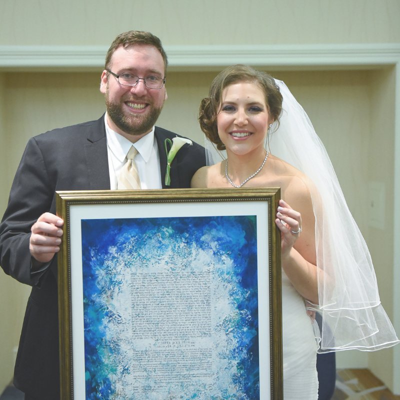 Lauren and her hubby make it O-FFI-CIAL! They signed their ketubah framed - beautiful and easy. A trustworthy framer can do this and then complete the framing after it's signed at the wedding. 

📜: Earth - Sapphire Ketubah
