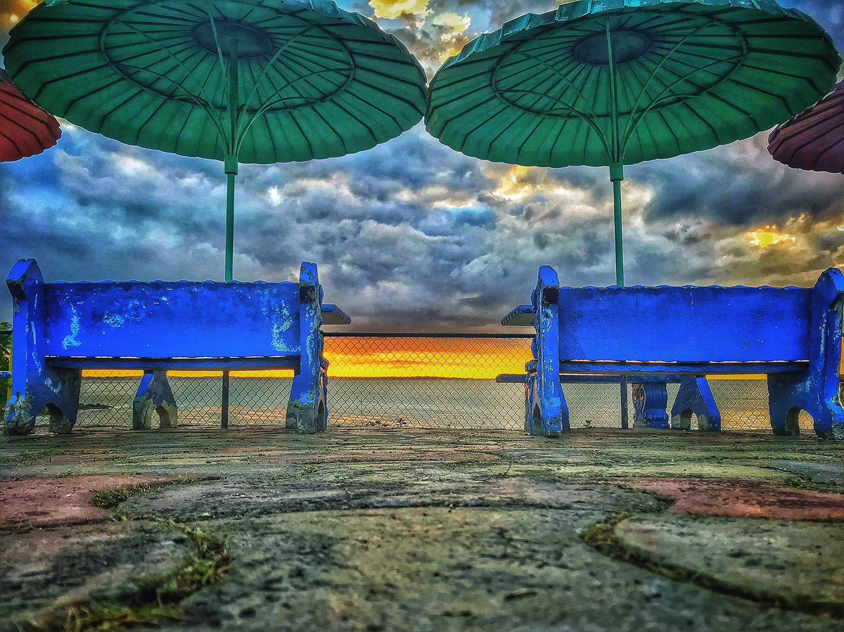 hammerclawmusic's tweet photo. Sunset 🌅 on 🤴 king’s Wharf.
.
.
.
.
.
#Trinidad #TrinidandTobago #SanFernando #Caribbean #Tropical #umbrella #beach #beachbench #sunset #clouds #beachchair #chair #beachumbrella  #ocean #caribbeansea #sunset #tile #Travel #exotic #wharf #streetphotography #freelance https://t.co/8pKso1oAiM