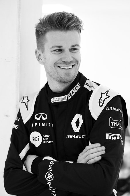 Nico in overalls at Enstone. He looks so good, he could be a model.