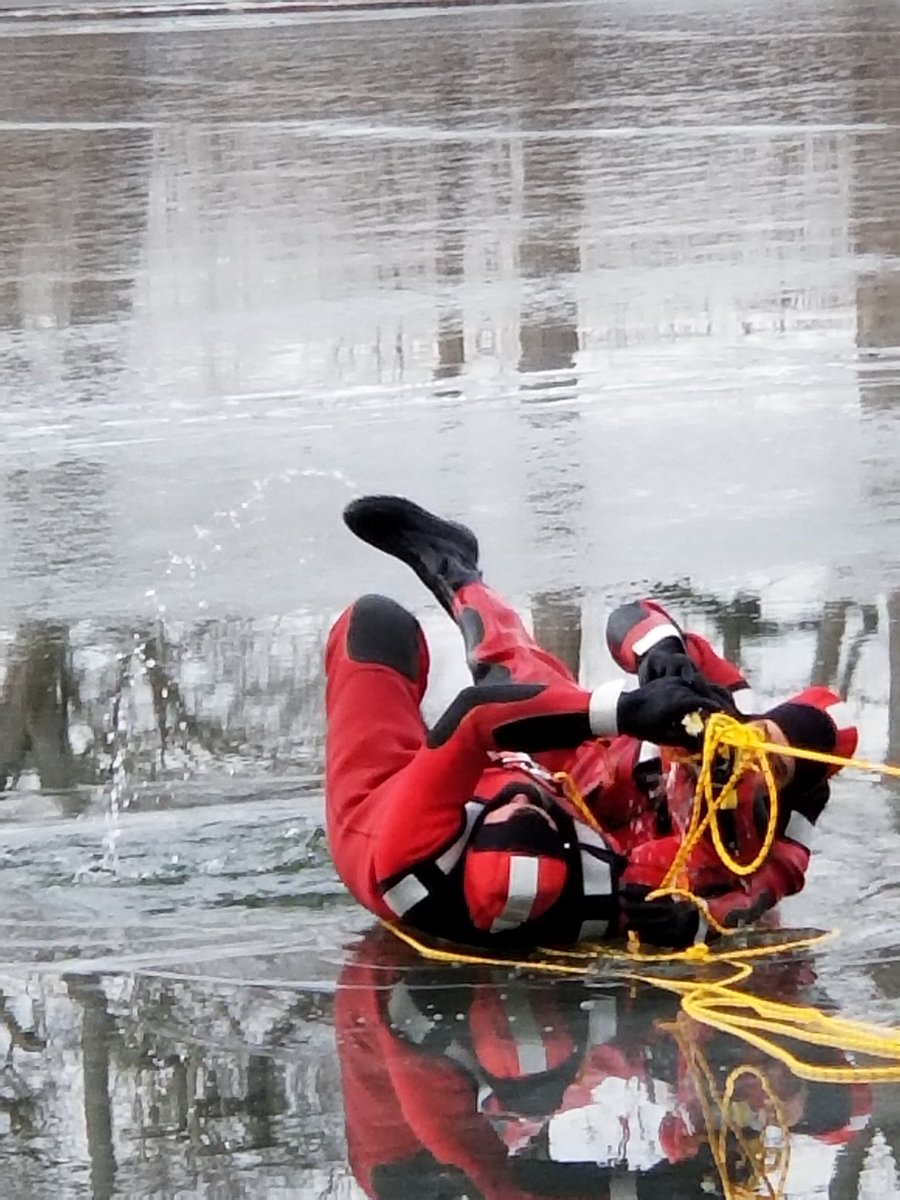 MFDOhio's tweet image. Firefighter Ben Bultman pulling victim from the icewater