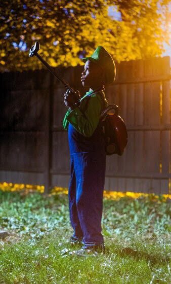 gennatay's tweet image. Guys. Don’t forgot to show off your kids Cosplays too. This is my son Micah as Luigi from Luigi’s Mansion. He saved his money to get the costume and painted the vacuum himself #28DaysOfBlackCosplay