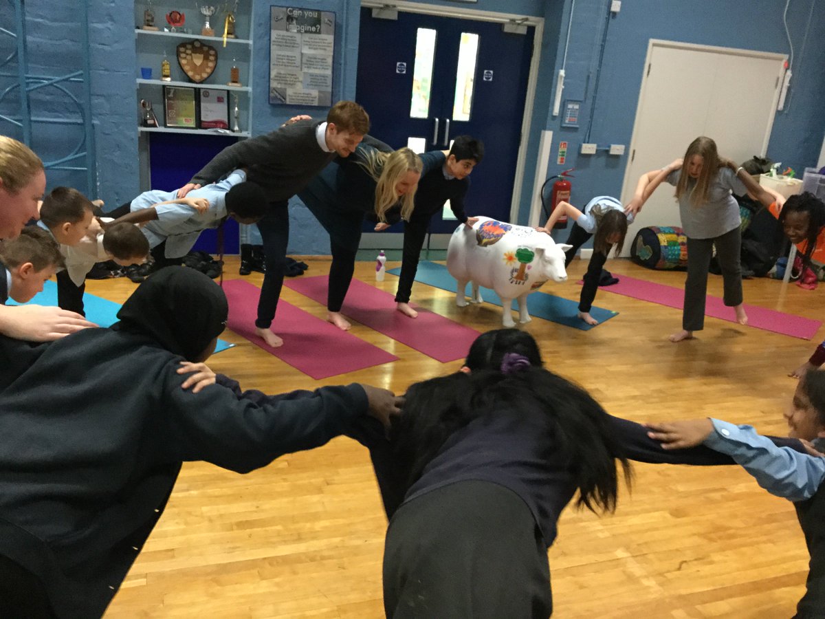 StJamesJuniorS1's tweet photo. It's Wellbeing Week at St James' - today we had an after-school Yoga session for children, families and staff with Gloucestershire Yoga For All. Baaa-rton joined in too! #Baaa-rton #GoodShepherdProject @glosdiocschools @GlosDioc https://t.co/EDn024QeSN