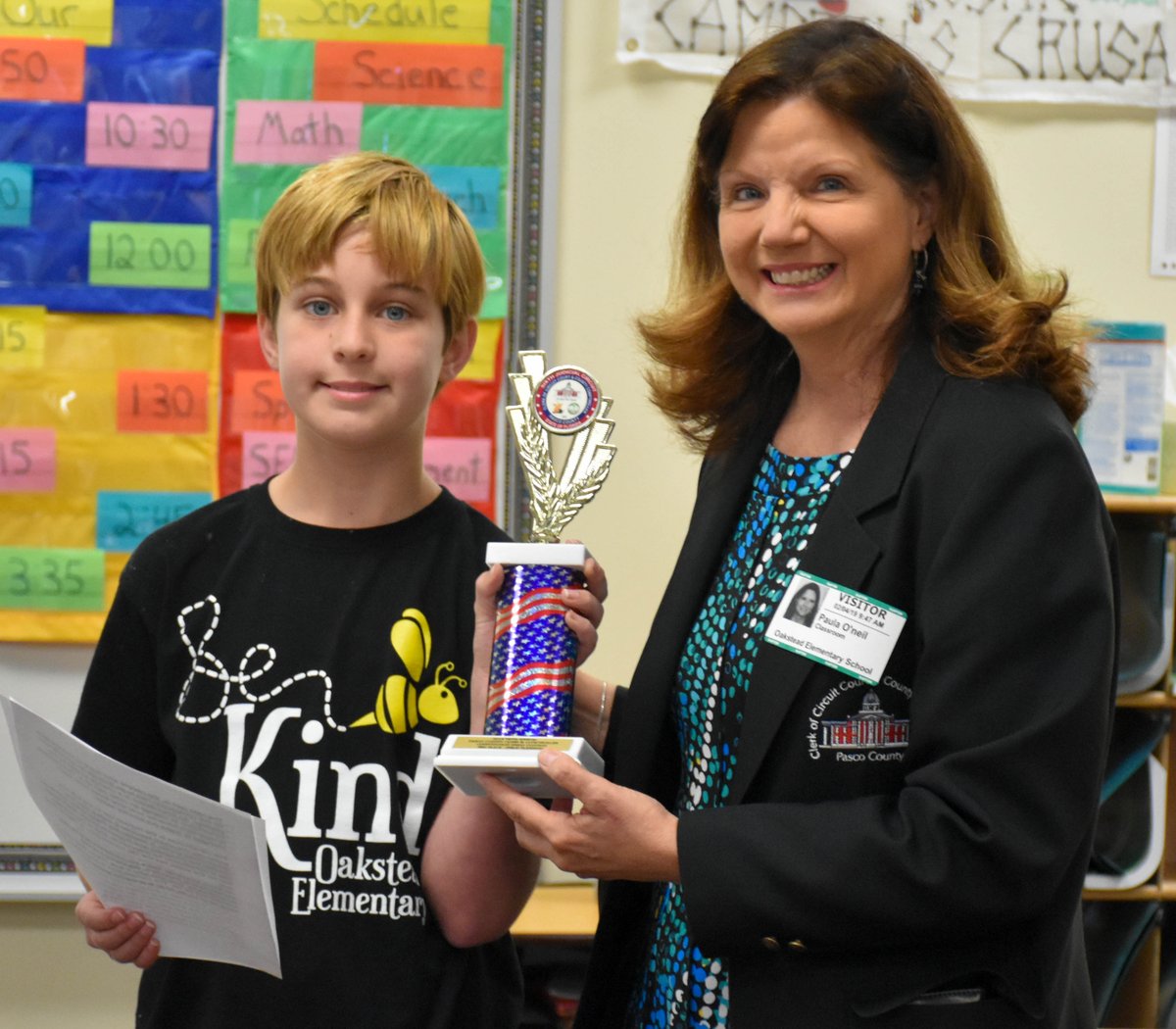 pascoclerk's tweet photo. Unable to make it to December's presentation to Board of @pascoschools, third-place finisher and @Oakstead_Otter Philip Fleming got a mini-ceremony w/classmates and @ClerkPaula Monday. Honorable mentions Della Krook and Ben Roorda had a moment, too.  https://t.co/LB0mHAS3jg https://t.co/H9WJzGc2vl