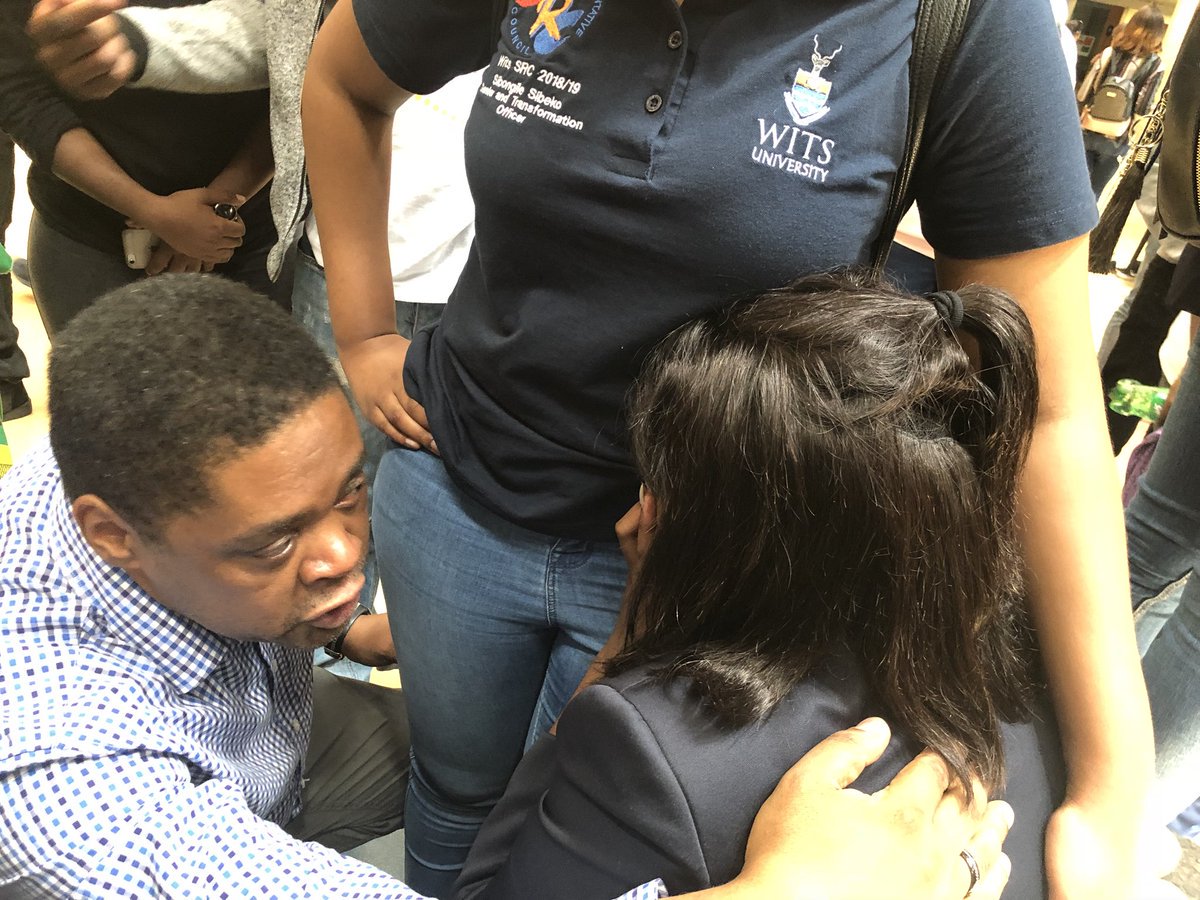 POWER987News's tweet photo. #WitsStrike SRC President Sisanda Mbolekwa is seen being comforted by the Dean of Students, Jerome September. Mbolekwa has been on a hunger strike since yesterday. https://t.co/SfyhkE7BXk