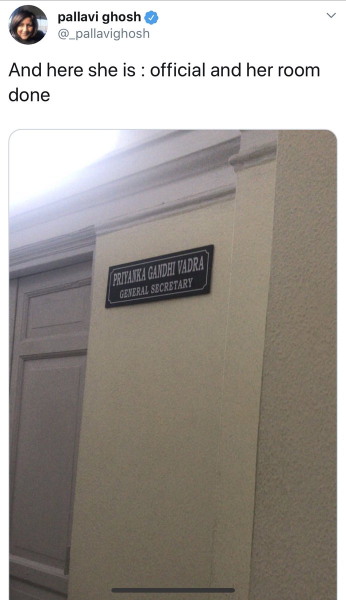 She is standing outside a room and taking pictures of the door. Aisa zillat waala kaam bhagwan kisi ki kismat main na likhe