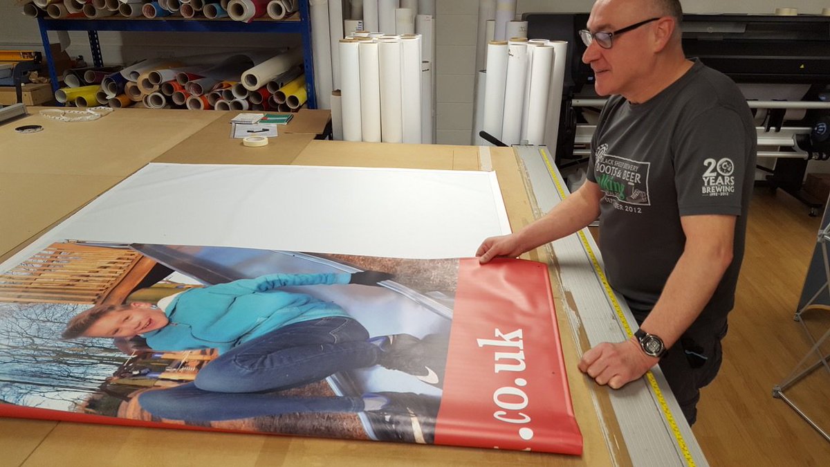 CSDprint's tweet image. Another busy day in our banner department. Here is Geoff quality checking a banner before its carefully packed and dispatched. Banners are one of THE most versatile promotional graphics. We print thousands of them. #PVCBanner #Banners #LargeFormatPrinting