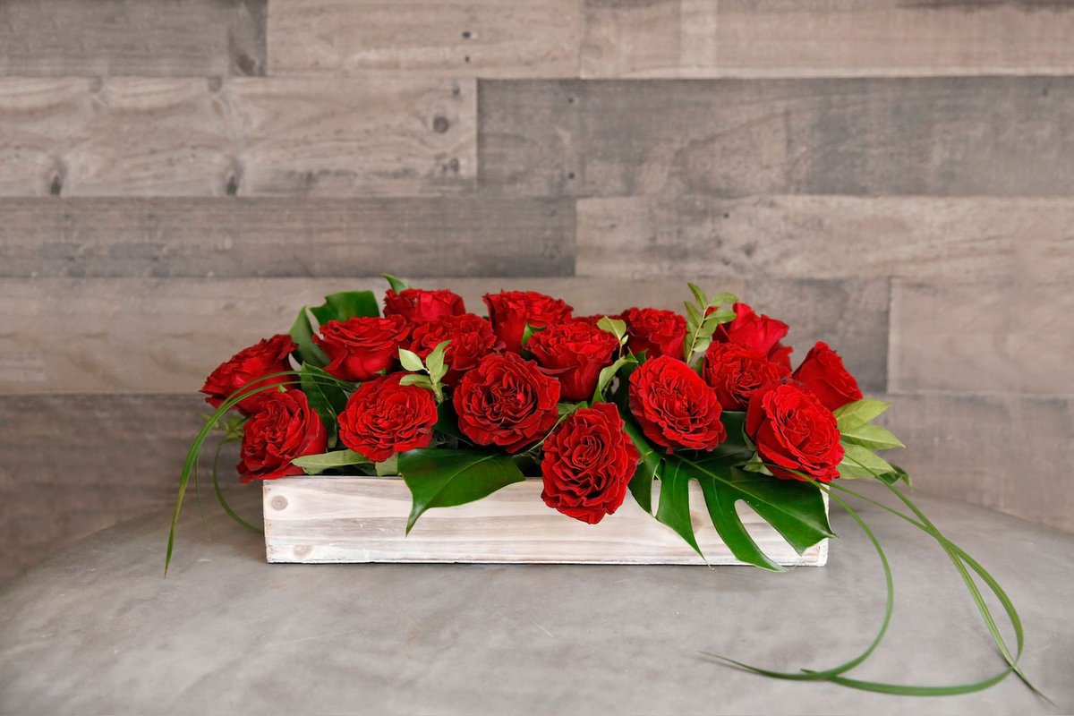 This is 18 red #heartsroses in a #pave style floral design for #ValentinesDay. Low wood box makes this the perfect combination of chic and Rustic. Shop now at jmorrisflowers.com/valentines-day/