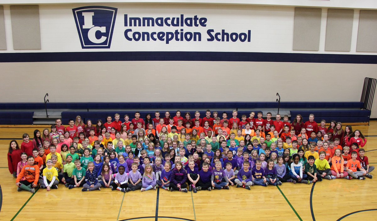 Our K-5 students at Immaculate Conception Elementary gathered together today for a colorful group photo today! #RegisPride